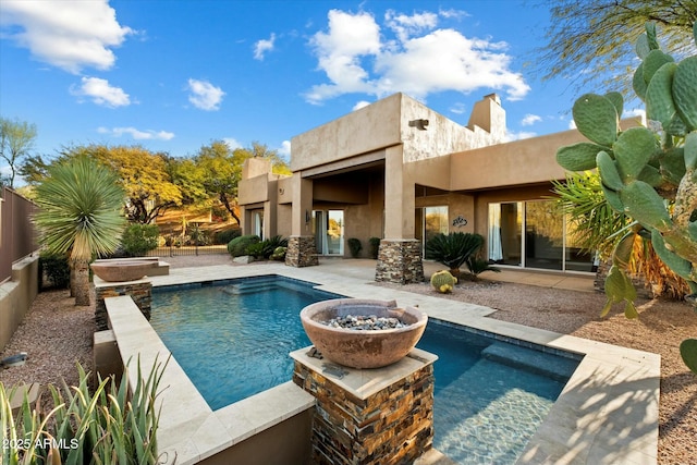 view of swimming pool featuring a fire pit and a patio