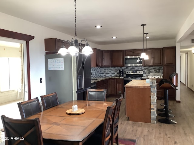 3607 E Mule Deer Rd, Pearce, AZ 85625 - dining area with a chandelier, light wood-style flooring, and recessed lighting