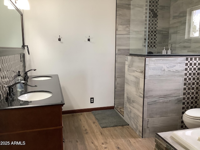3607 E Mule Deer Rd, Pearce, AZ 85625 - bathroom with a walk in shower, wood finished floors, baseboards, and double vanity