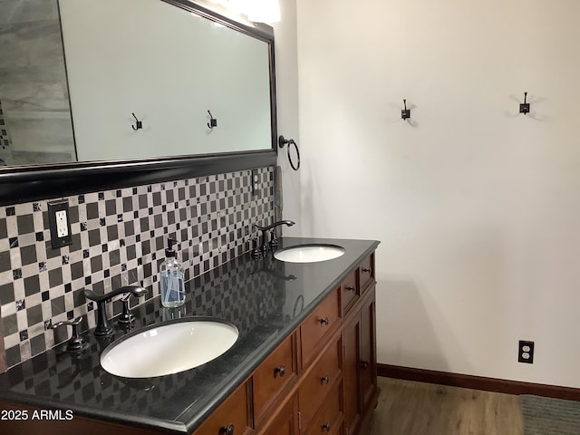 3607 E Mule Deer Rd, Pearce, AZ 85625 - bathroom featuring backsplash, wood finished floors, double vanity, and baseboards