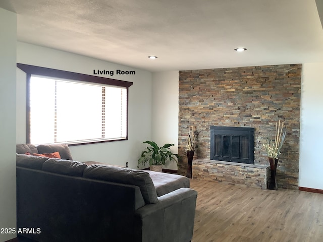 3607 E Mule Deer Rd, Pearce, AZ 85625 - living room featuring wood finished floors, a fireplace, and recessed lighting