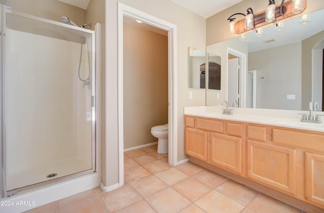 full bathroom with tile patterned flooring, a sink, a shower stall, and toilet