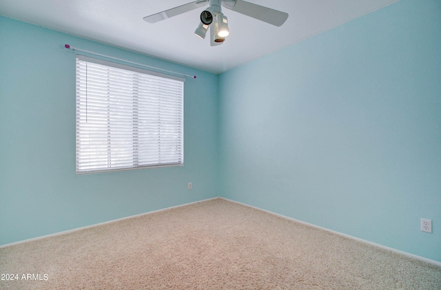 carpeted empty room with ceiling fan