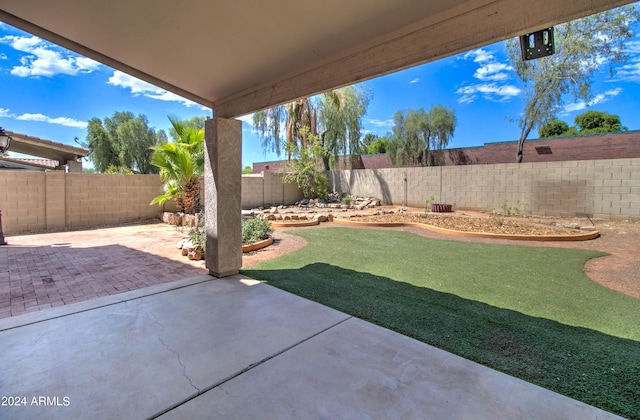 view of yard featuring a fenced backyard and a patio