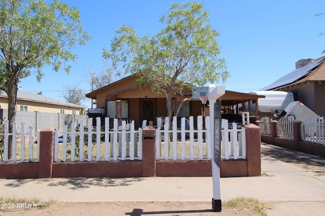 1211 E Fillmore St, Phoenix, AZ 85006 - view of front facade with covered porch and a fenced front yard