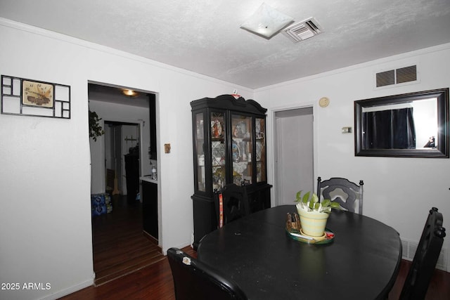 1211 E Fillmore St, Phoenix, AZ 85006 - dining room featuring dark wood-style floors and a textured ceiling