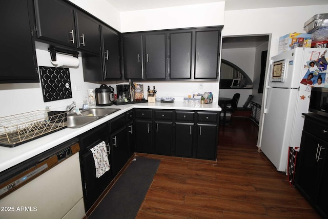 1211 E Fillmore St, Phoenix, AZ 85006 - kitchen with white appliances, dark cabinetry, dark wood finished floors, and light countertops