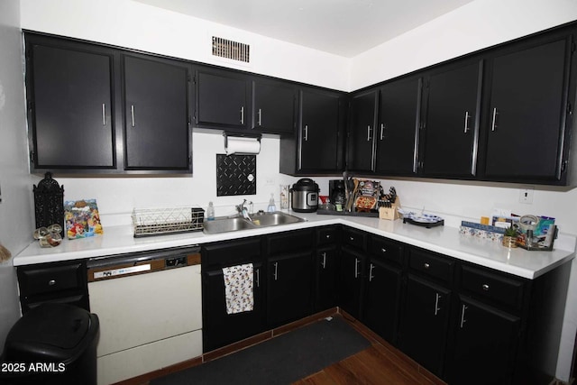 1211 E Fillmore St, Phoenix, AZ 85006 - kitchen featuring dishwasher, dark cabinets, and light countertops