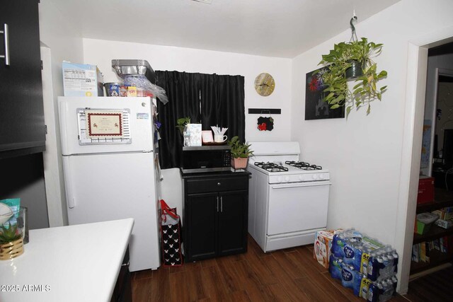 1211 E Fillmore St, Phoenix, AZ 85006 - kitchen with white appliances, dark wood-type flooring, light countertops, and dark cabinets
