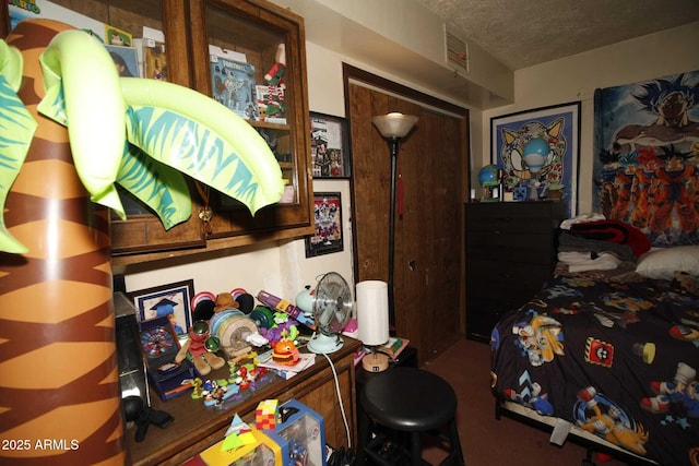 1211 E Fillmore St, Phoenix, AZ 85006 - bedroom with a textured ceiling, a closet, and carpet floors