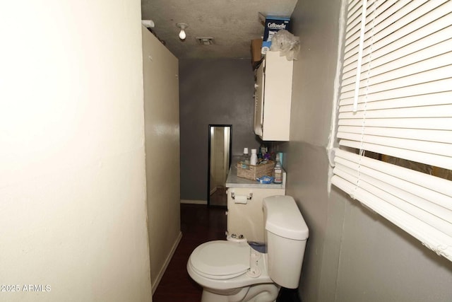 1211 E Fillmore St, Phoenix, AZ 85006 - bathroom with toilet and baseboards