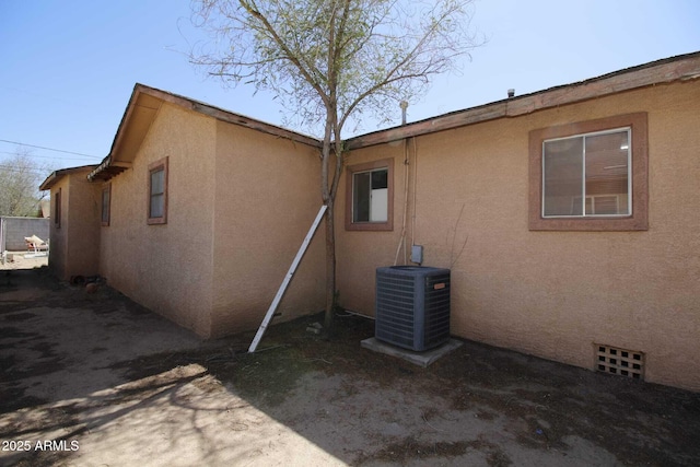 1211 E Fillmore St, Phoenix, AZ 85006 - view of property exterior featuring a central AC unit and stucco siding
