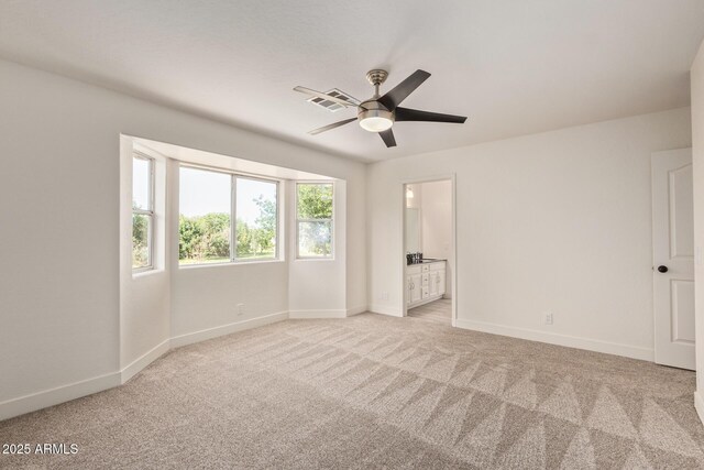19006 E Karsten Dr, Queen Creek, AZ 85142 - unfurnished bedroom featuring carpet flooring, baseboards, ensuite bathroom, and ceiling fan