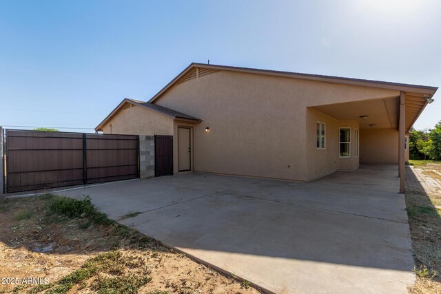 19006 E Karsten Dr, Queen Creek, AZ 85142 - view of home's exterior featuring stucco siding and a gate