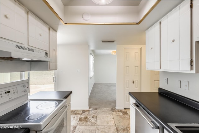 kitchen with white range with electric cooktop, under cabinet range hood, white cabinetry, stainless steel dishwasher, and dark countertops
