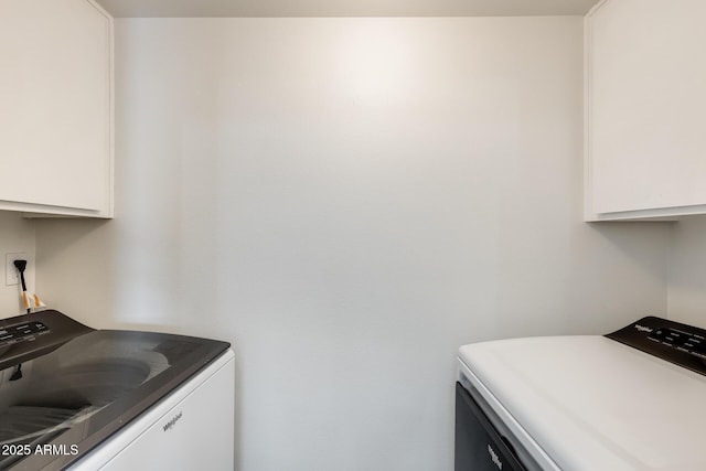 laundry area with washer and clothes dryer and cabinet space
