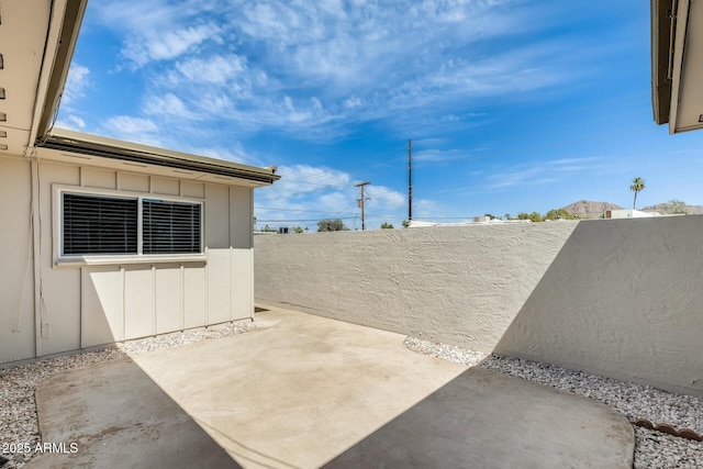 view of patio featuring fence