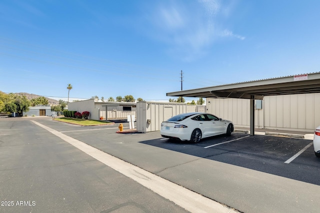 view of partially covered parking lot