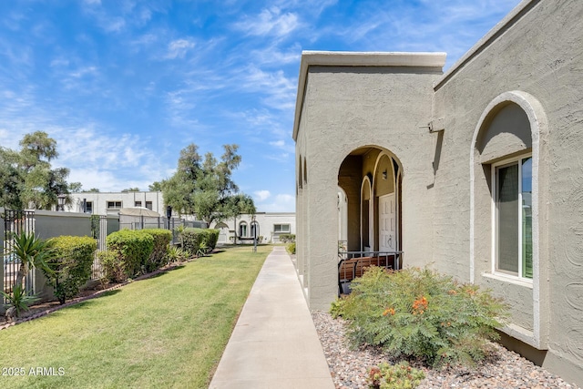 doorway to property featuring stucco siding