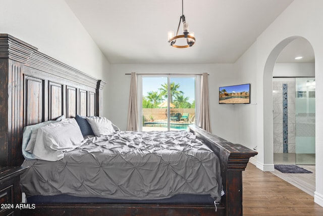 bedroom featuring hardwood / wood-style floors and access to exterior