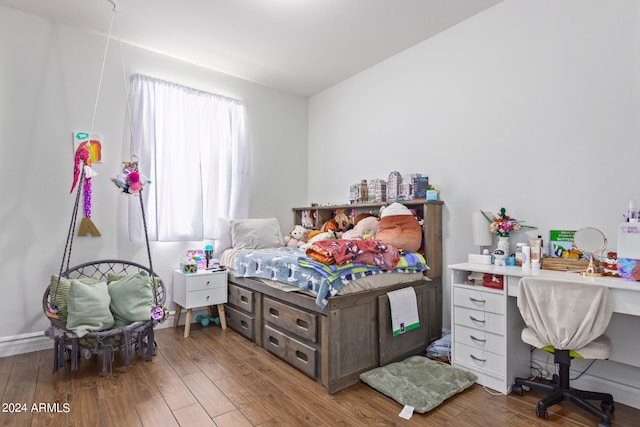 bedroom featuring wood-type flooring