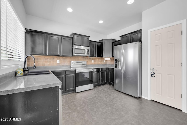 14521 W Gelding Dr, Surprise, AZ 85379 - kitchen featuring light countertops, tasteful backsplash, recessed lighting, a sink, and appliances with stainless steel finishes