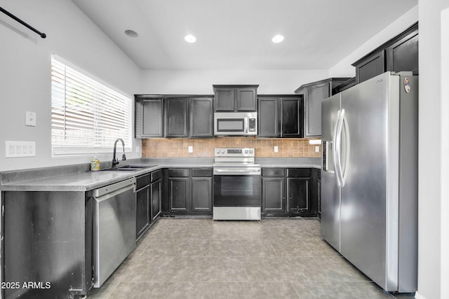 14521 W Gelding Dr, Surprise, AZ 85379 - kitchen featuring a sink, recessed lighting, decorative backsplash, and appliances with stainless steel finishes