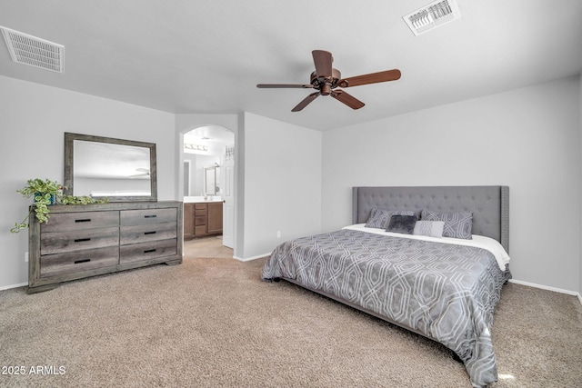 14521 W Gelding Dr, Surprise, AZ 85379 - bedroom featuring baseboards, visible vents, arched walkways, and carpet floors