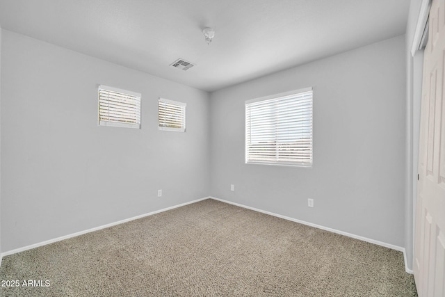 14521 W Gelding Dr, Surprise, AZ 85379 - carpeted empty room with baseboards and visible vents