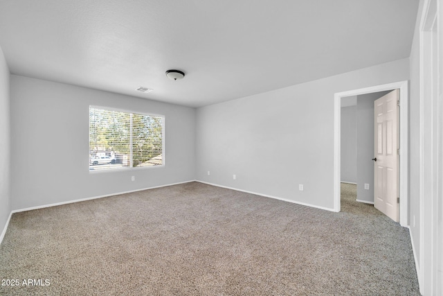 14521 W Gelding Dr, Surprise, AZ 85379 - empty room with baseboards, carpet floors, and visible vents
