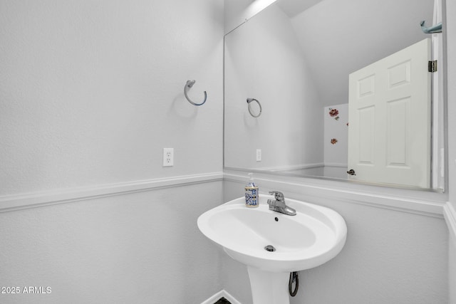 14521 W Gelding Dr, Surprise, AZ 85379 - bathroom featuring a sink and vaulted ceiling