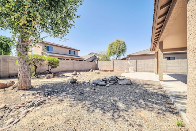 14521 W Gelding Dr, Surprise, AZ 85379 - view of yard featuring a fenced backyard and a patio area