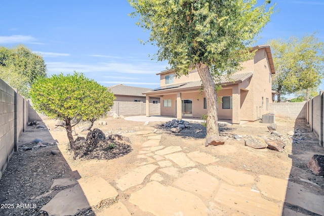 14521 W Gelding Dr, Surprise, AZ 85379 - back of house with a tiled roof, a patio, a fenced backyard, solar panels, and stucco siding