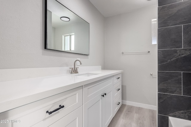 bathroom featuring vanity and wood-type flooring