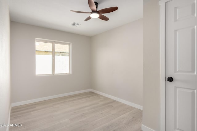 spare room with ceiling fan and light hardwood / wood-style flooring