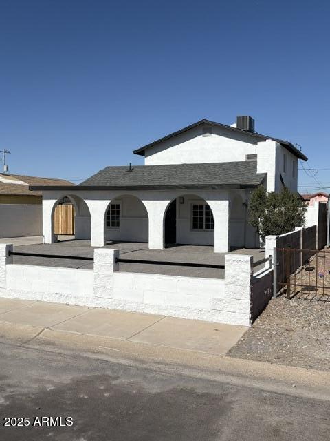 view of front of house featuring cooling unit