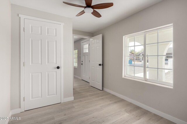 spare room featuring ceiling fan and light wood-type flooring