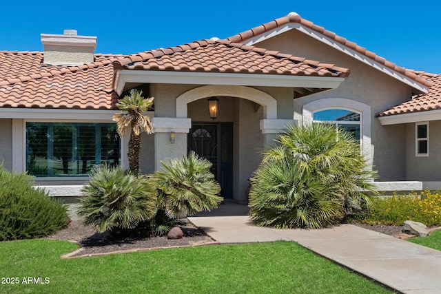 3822 E Florian Ave, Mesa, AZ 85206 - view of front of property with a tiled roof, stucco siding, and a chimney