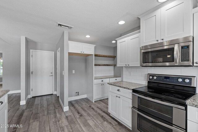 3822 E Florian Ave, Mesa, AZ 85206 - kitchen featuring appliances with stainless steel finishes, baseboards, open shelves, decorative backsplash, and white cabinetry