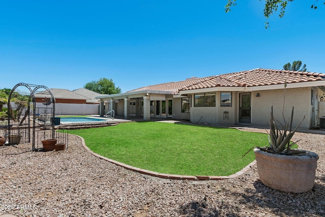 3822 E Florian Ave, Mesa, AZ 85206 - rear view of house with a tile roof, stucco siding, and central air condition unit