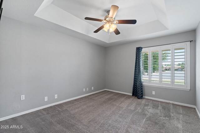 3822 E Florian Ave, Mesa, AZ 85206 - spare room featuring a tray ceiling, carpet floors, ceiling fan, and baseboards