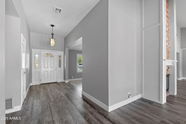 3822 E Florian Ave, Mesa, AZ 85206 - entrance foyer featuring dark wood-type flooring, baseboards, and vaulted ceiling
