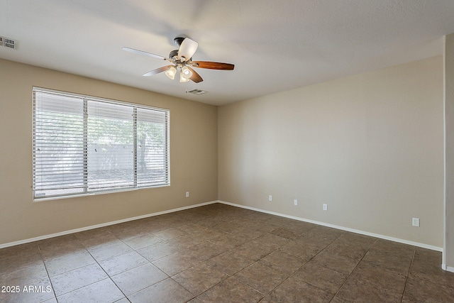 5926 W Questa Dr, Glendale, AZ 85310 - spare room with visible vents, a ceiling fan, baseboards, and tile patterned flooring