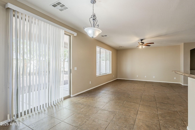 5926 W Questa Dr, Glendale, AZ 85310 - spare room featuring baseboards, ceiling fan, tile patterned flooring, and visible vents