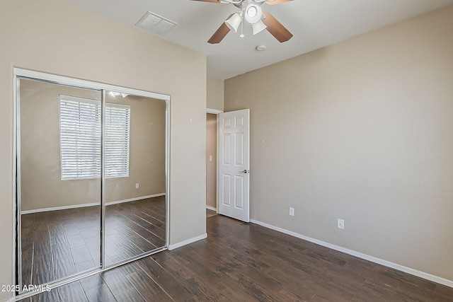 5926 W Questa Dr, Glendale, AZ 85310 - unfurnished bedroom with visible vents, baseboards, wood finished floors, and a closet