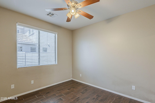 5926 W Questa Dr, Glendale, AZ 85310 - spare room featuring visible vents, baseboards, and dark wood-style floors