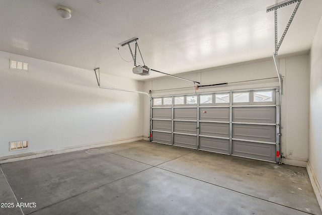 5926 W Questa Dr, Glendale, AZ 85310 - garage with baseboards and a garage door opener