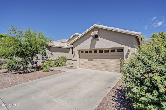 5926 W Questa Dr, Glendale, AZ 85310 - single story home with stucco siding, an attached garage, driveway, and a tiled roof