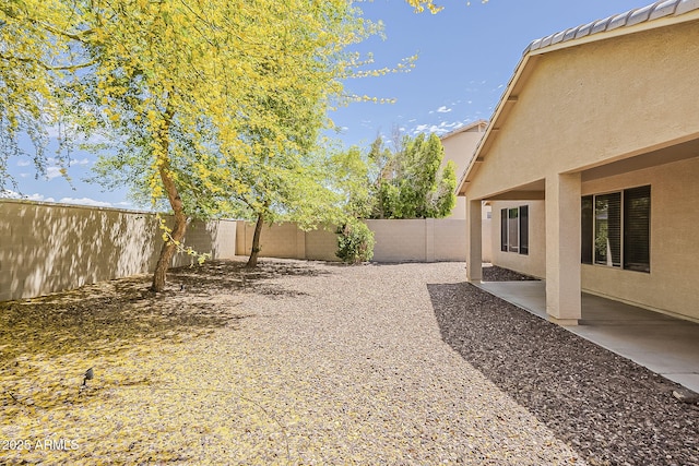 5926 W Questa Dr, Glendale, AZ 85310 - view of yard featuring a fenced backyard and a patio area