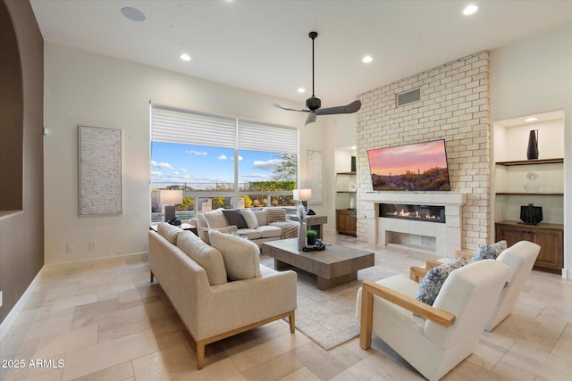 8599 E Sand Flower Dr, Scottsdale, AZ 85266 - living area with a fireplace, baseboards, recessed lighting, and ceiling fan